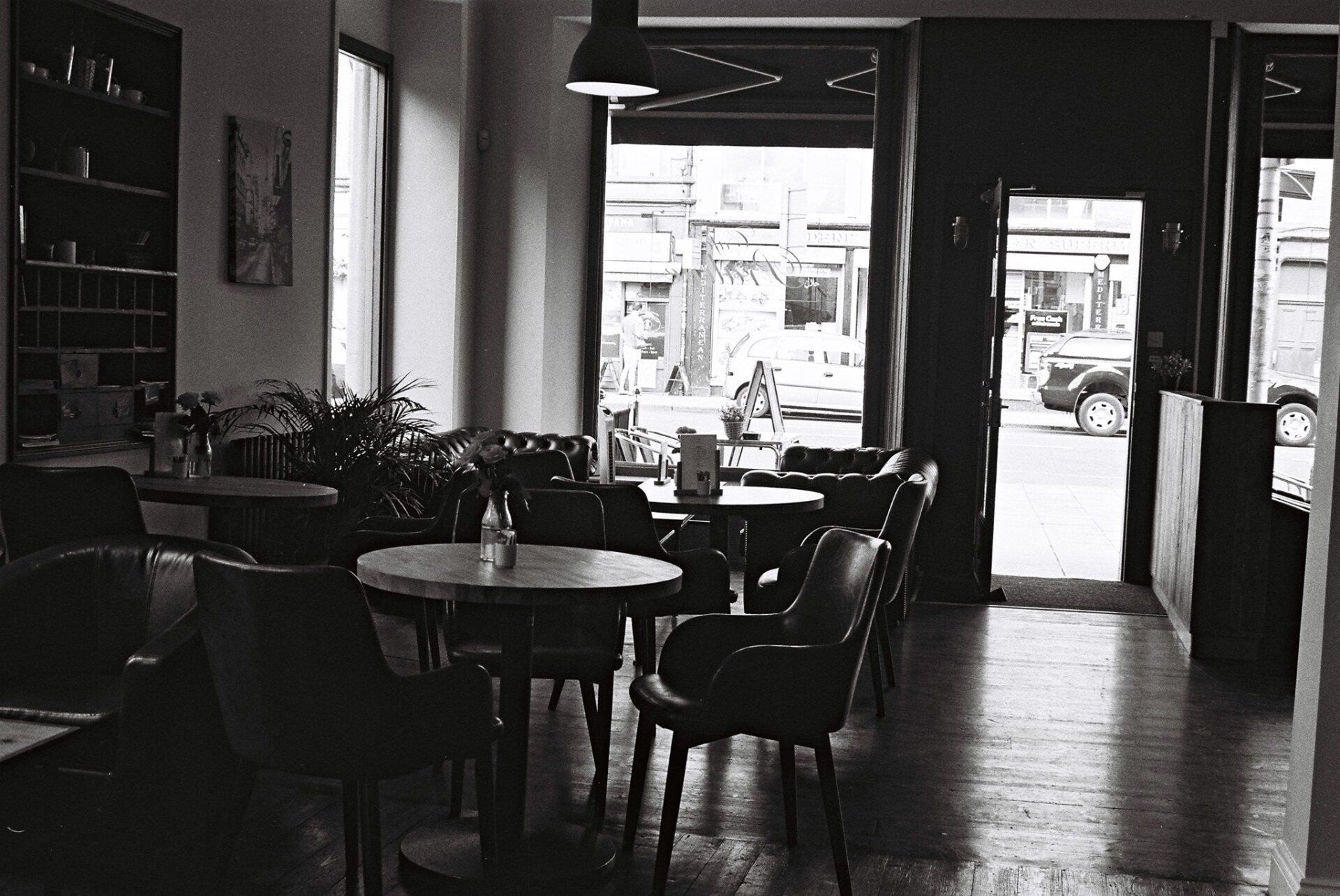 Café Praline interior on Leith Walk, with tables looking out to the street